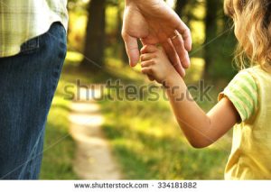 stock-photo-the-parent-holds-the-hand-of-a-small-child-334181882