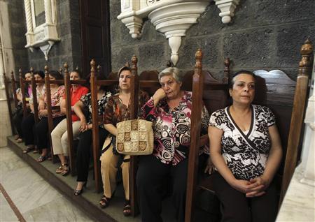 Syrian women attend mass in the Catholic Patriarchate in Damascus, September 7, 2013. REUTERS/Khaled al Hariri