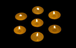 seven-candles-burning-black-background-45741898