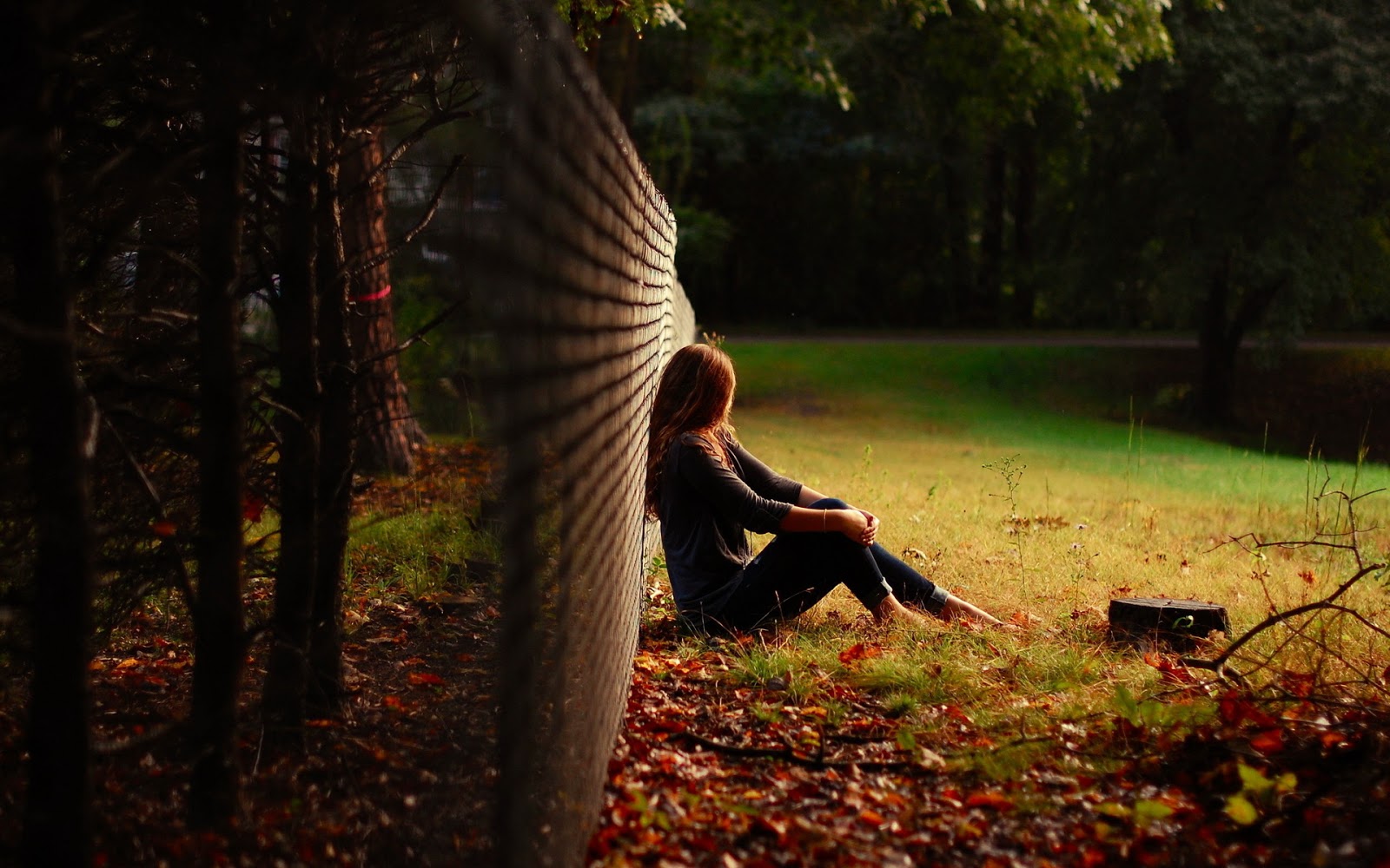 cute-young-girl-sitting-in-park-thinking-of-her-lost-love-dreams-picture