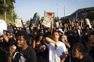 TORONTO, ON- JULY 27 - Josh Cedro (centre right), 16, chants with the crowd during Black Lives Matter protest that marched from Gilbert Avenue to Allen Road on Eglinton Avenue. The protest shut down the southbound Allen Road for around 30 minutes, causing traffic to reverse and exit through Lawrence Avenue.        (Melissa Renwick/Toronto Star via Getty Images)