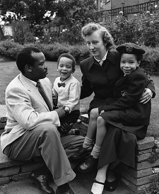1956, London, England, UK --- Seretse Khama, later the first President of Botswana when it gained independence, with his wife Ruth, and children in the garden of their Croydon home. --- Image by © Hulton-Deutsch Collection/CORBIS