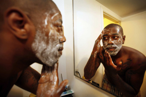 Marquez Briggs, 30, uses a foaming scrub cleanser during his morning routine on Monday June 18, 2012 as mens grooming products are gaining popularity. (Al Seib/Los Angeles Times/MCT)