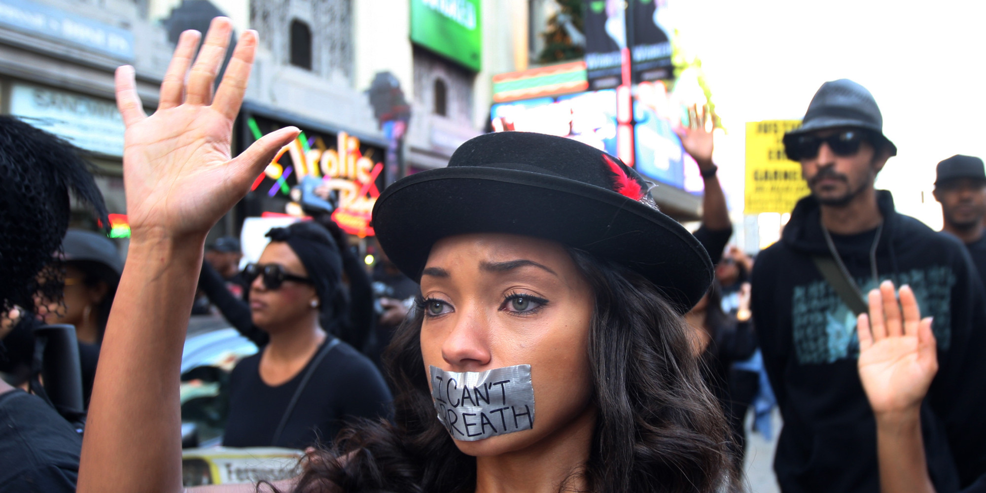 LOS ANGELES, CA - DECEMBER 6:  People march on Hollywood Boulevard in protest of the decision in New York not to indict a police officer involved in the choke-hold death of Eric Garner on December 6, 2014 in the Hollywood section of Los Angeles, California. The march passes the tourist attraction of Hollywood and Highland where, by coincidence, police shot and killed a man in the intersection. Police say that he had a knife.   (Photo by David McNew/Getty Images)